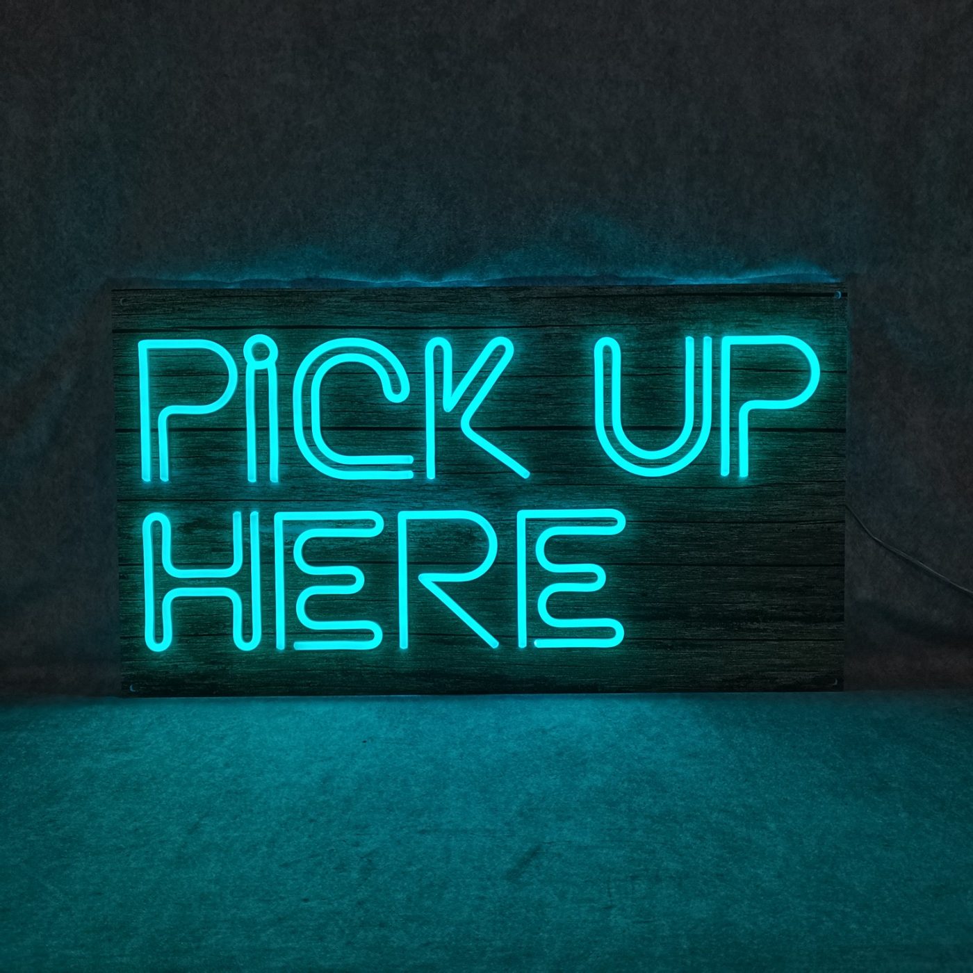 Pick Up Here custom LED neon sign on wood — Calgary neon signs