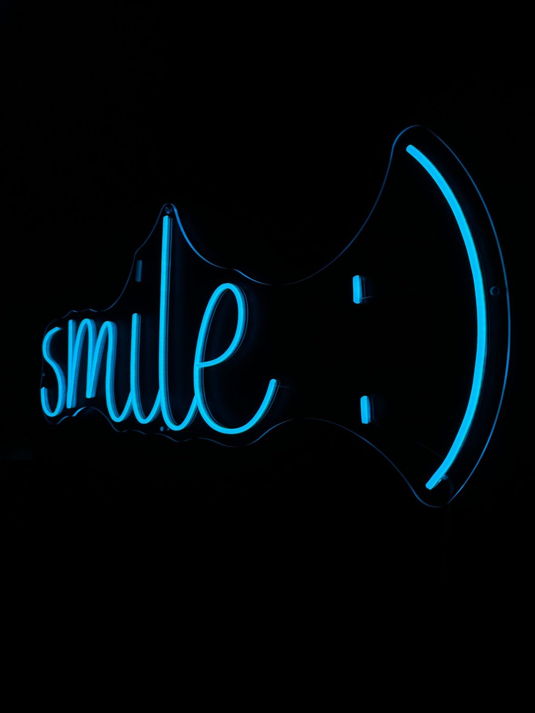 Smile blue LED neon sign for dental office — custom neon signs Calgary