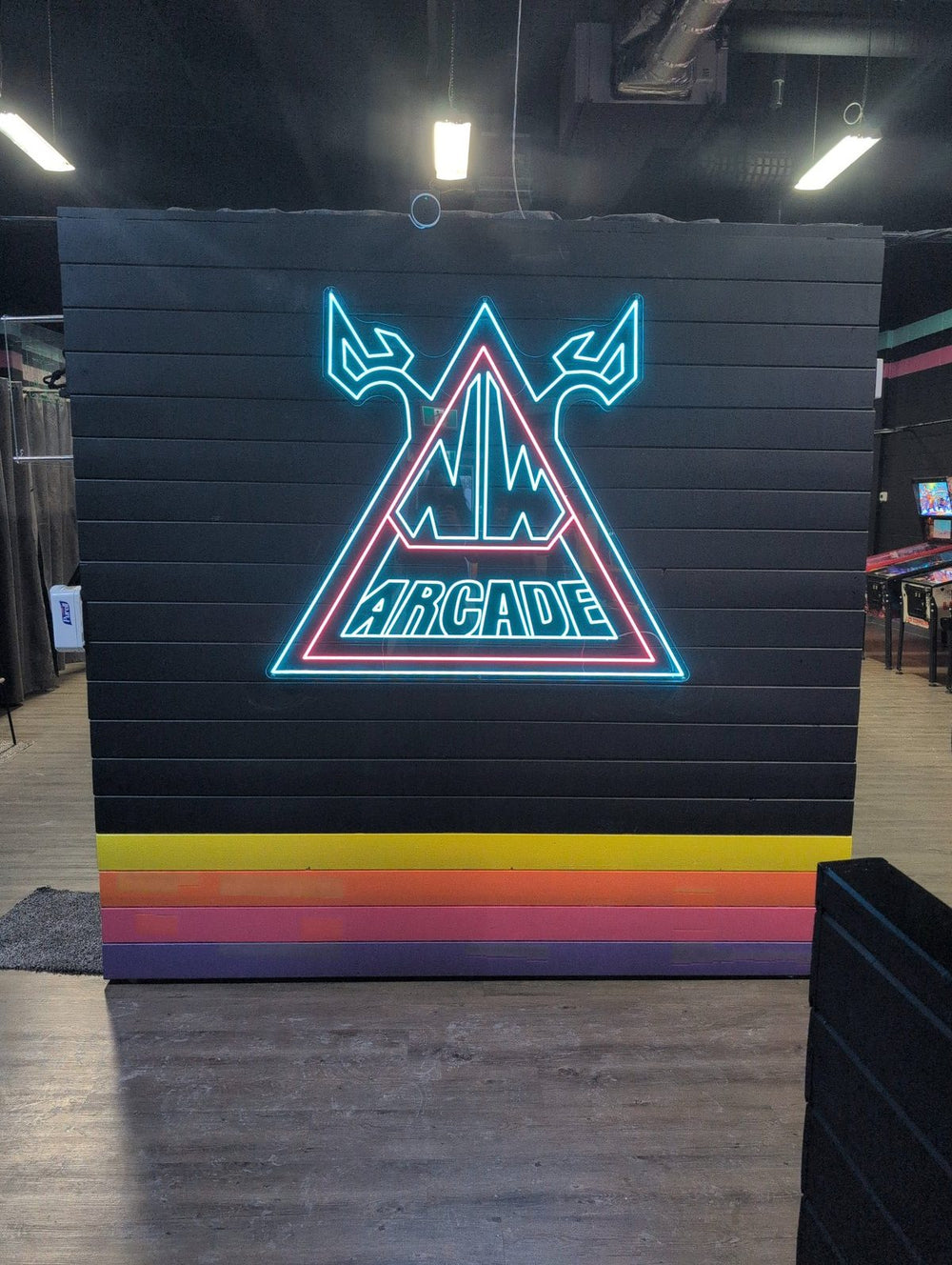 NW Arcade custom LED neon triangle logo sign — Calgary neon fabrication