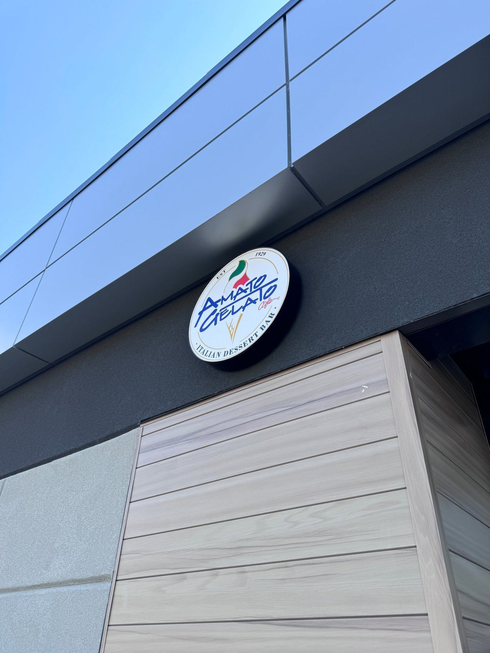 Amato Gelato round illuminated lightbox sign — NEON YYC Calgary
