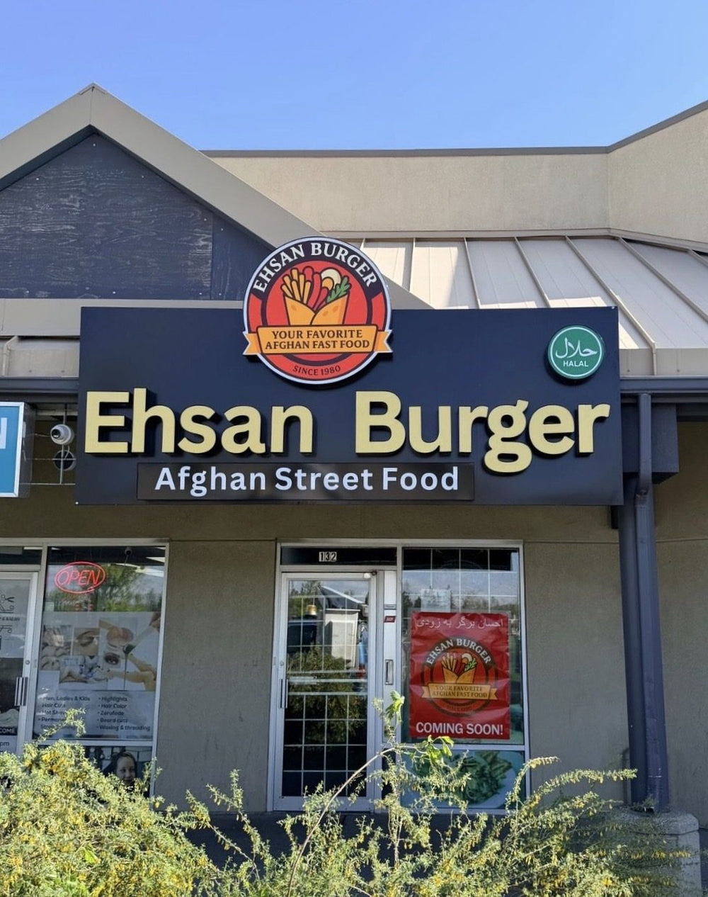 Ehsan Burger storefront sign during the day — NEON YYC Calgary