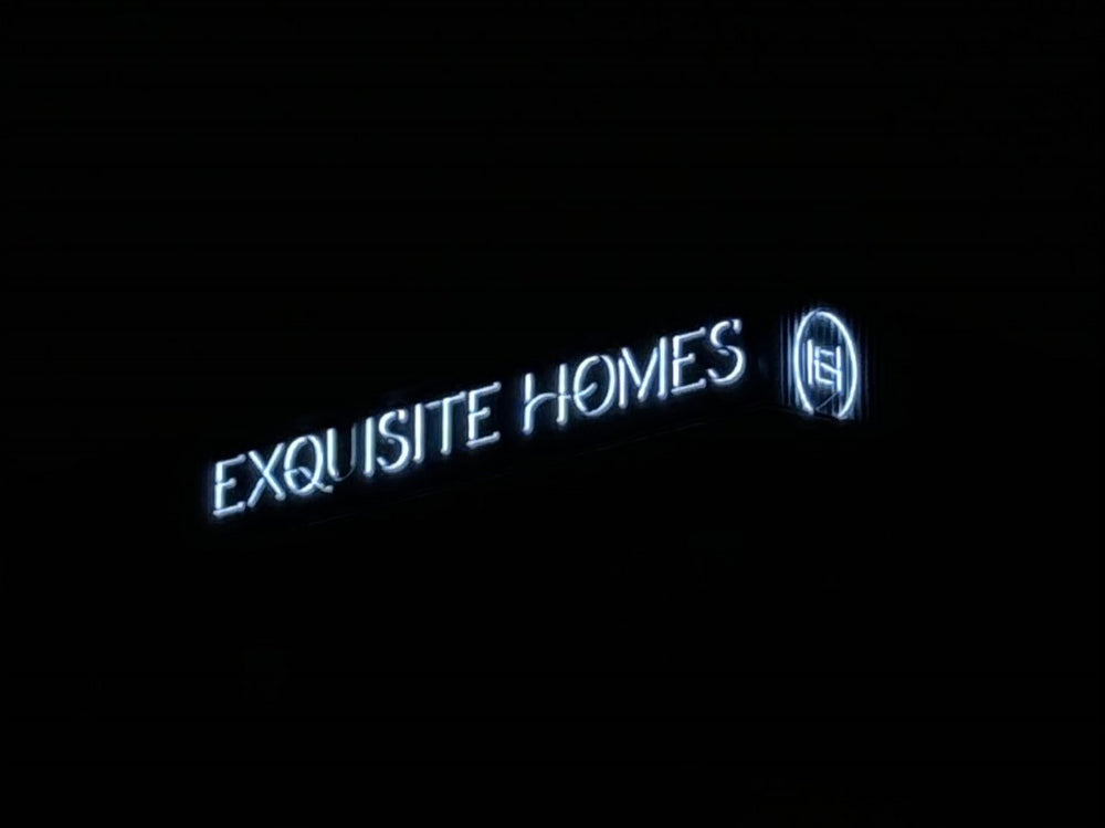 Exquisite Homes backlit letters at night — NEON YYC Calgary