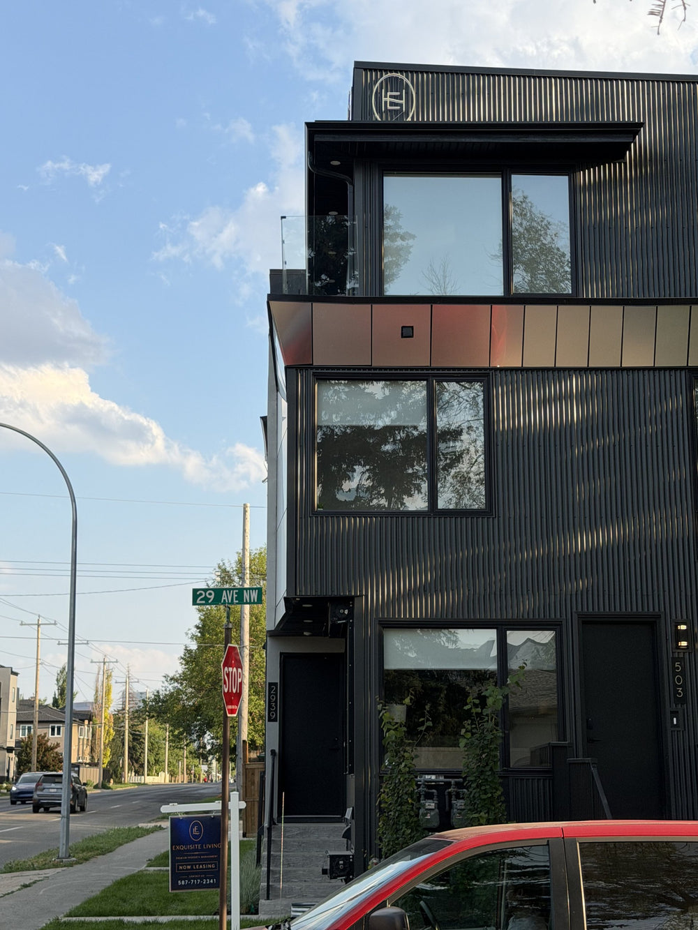 Exquisite Homes backlit logo by day — NEON YYC Calgary