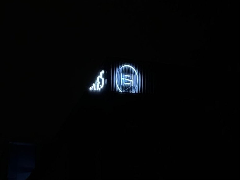 Exquisite Homes backlit logo at night — NEON YYC Calgary