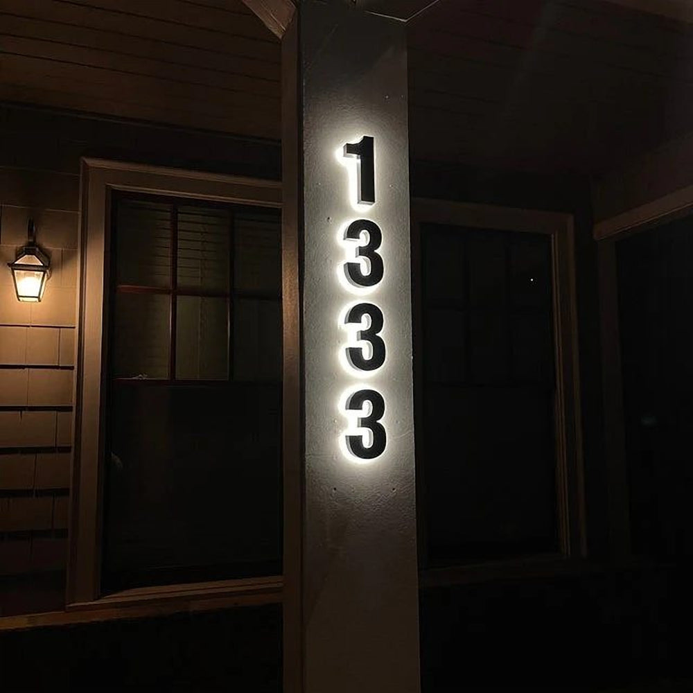 Halo-lit address numbers on porch pillar night — backlit signs Calgary