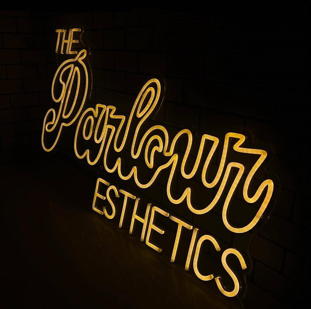 The Parlour Esthetics gold LED neon sign — custom neon signs Calgary