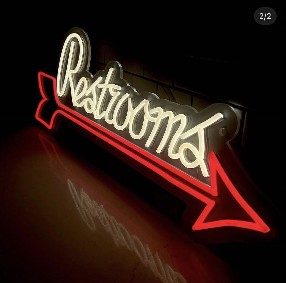 Restrooms arrow LED neon wayfinding sign — NEON YYC Calgary
