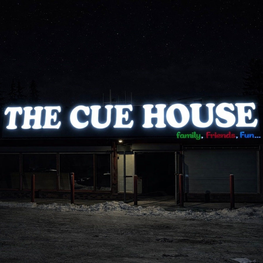 The Cue House channel letters at night — channel letters Calgary by NEON YYC