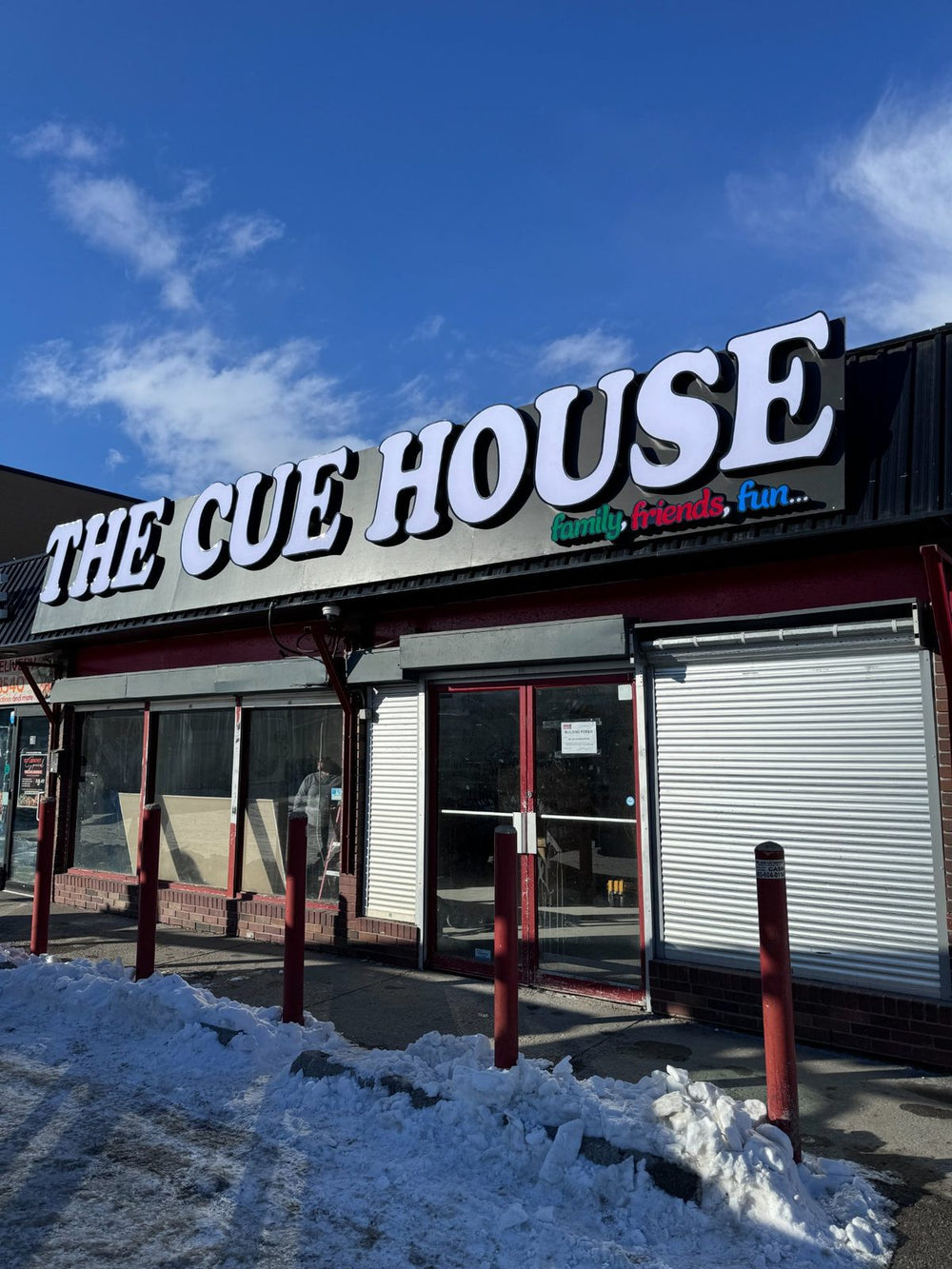 The Cue House illuminated channel letter storefront — commercial signs Calgary
